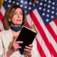 House Speaker Nancy Pelosi of Calif., reading from the Bible, reacts to President Donald Trump during a news conference at the U.S. Capitol in Washington, Tuesday, June 2, 2020.